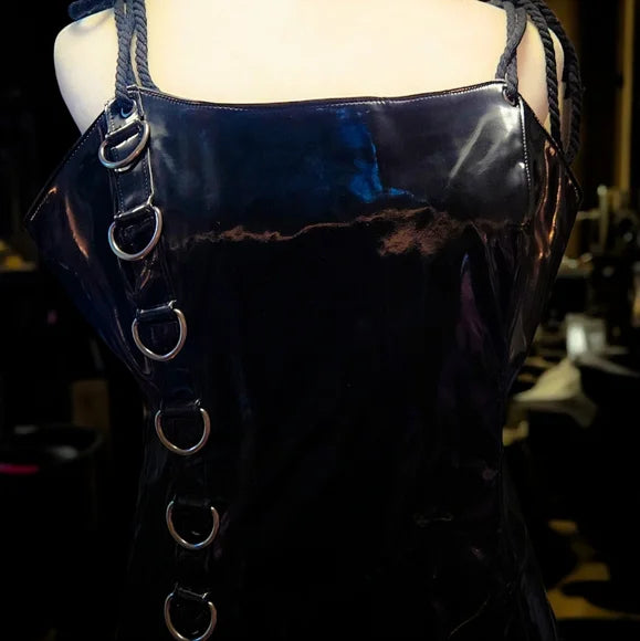 NWT Ambient O-Ring Mini Dress DARKER WAVS SZ LG  In a vinyl construction with a liquid sheen finish. O-ring hardware, adjustable rope shoulder ties, embroidered “D” logo on the back, and a back zipper closure