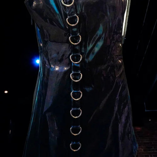 NWT Ambient O-Ring Mini Dress DARKER WAVS SZ LG  In a vinyl construction with a liquid sheen finish. O-ring hardware, adjustable rope shoulder ties, embroidered “D” logo on the back, and a back zipper closure