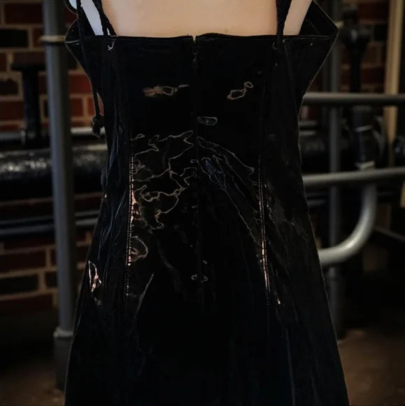 NWT Ambient O-Ring Mini Dress DARKER WAVS SZ LG  In a vinyl construction with a liquid sheen finish. O-ring hardware, adjustable rope shoulder ties, embroidered “D” logo on the back, and a back zipper closure